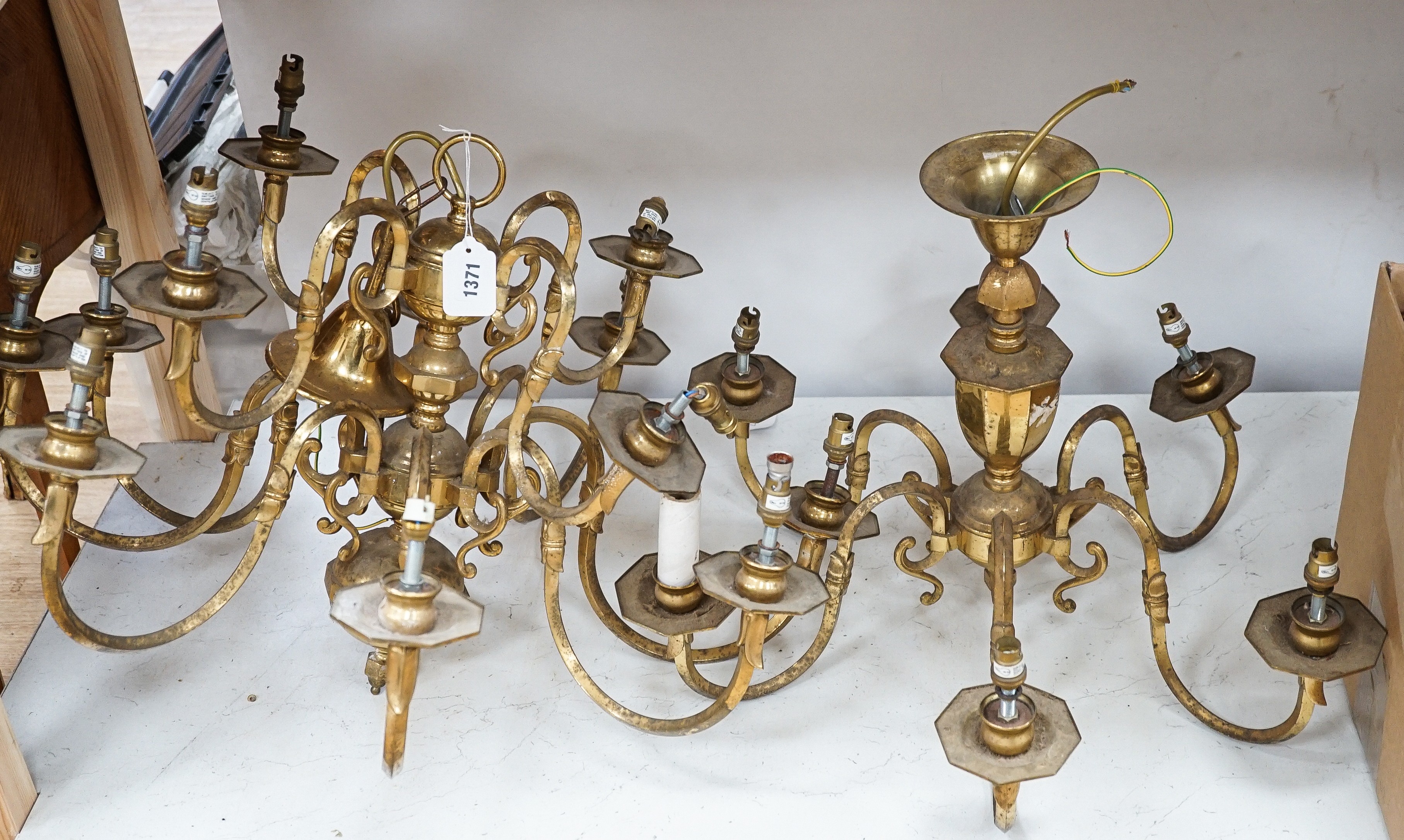 A brass two tier twelve branch electrolier and an associated six branch electrolier, 12 branch 46 cms high.